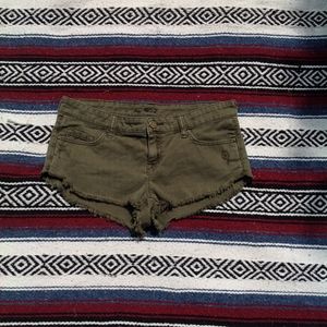 BDG olive green distressed low rise dolphin shorts